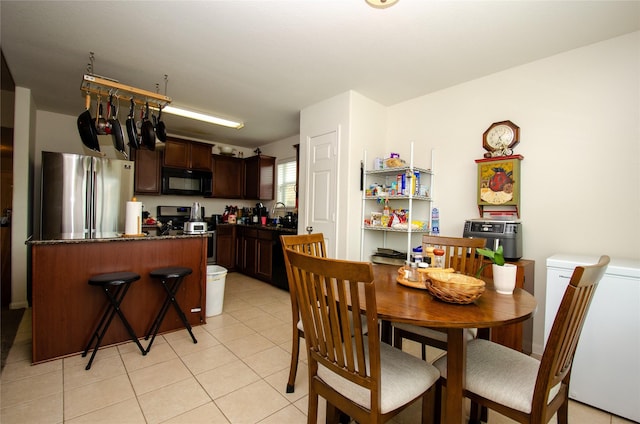 9414 Emerald Green Dr, Rosharon, TX 77583 - dining area with light tile patterned floors