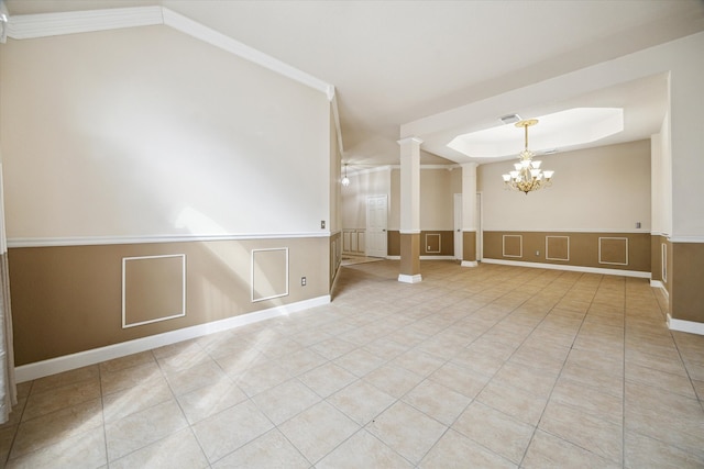 10115 Willow Crossing Dr, Houston, TX 77064 - tiled spare room with a chandelier, decorative columns, a decorative wall, wainscoting, and a raised ceiling