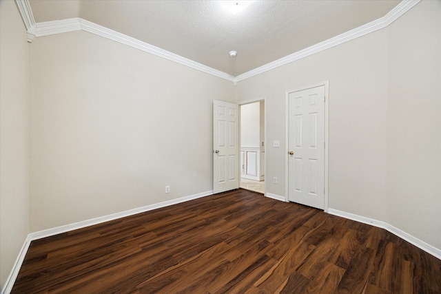 10115 Willow Crossing Dr, Houston, TX 77064 - empty room featuring dark wood-style flooring, baseboards, and crown molding