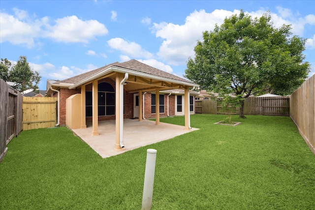 10115 Willow Crossing Dr, Houston, TX 77064 - rear view of property featuring a patio area, brick siding, and a shingled roof
