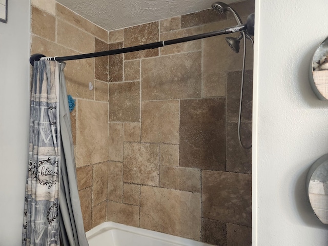 27491 Lantern Ln, New Caney, TX 77357 - bathroom featuring shower / tub combo and a textured ceiling
