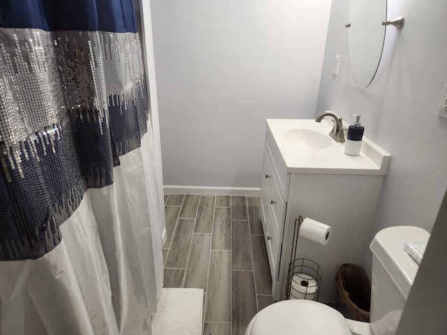 27491 Lantern Ln, New Caney, TX 77357 - full bathroom with vanity, wood tiled floors, and curtained shower