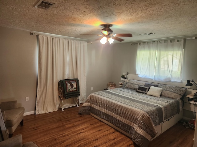 27491 Lantern Ln, New Caney, TX 77357 - bedroom with wood finished floors, a textured ceiling, and ceiling fan