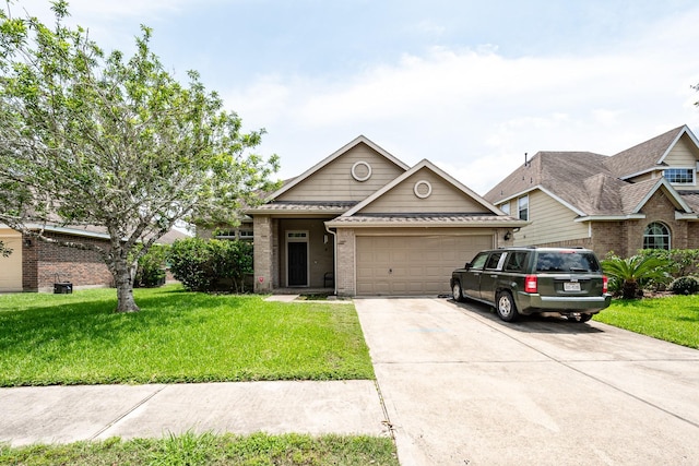 934 Sage St, Baytown, TX 77521 - traditional-style house featuring brick siding, an attached garage, a front lawn, and driveway