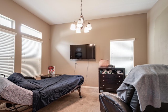 934 Sage St, Baytown, TX 77521 - carpeted bedroom with a chandelier and baseboards