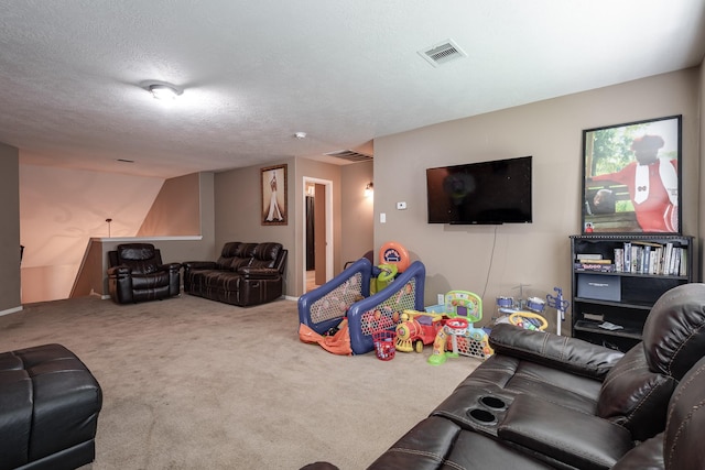 934 Sage St, Baytown, TX 77521 - living room featuring carpet floors and a textured ceiling
