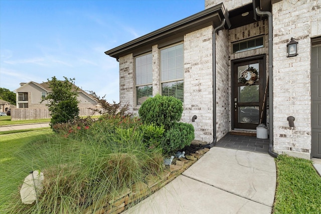 6903 Aspen Peak Dr, Baytown, TX 77521 - view of exterior entry featuring brick siding