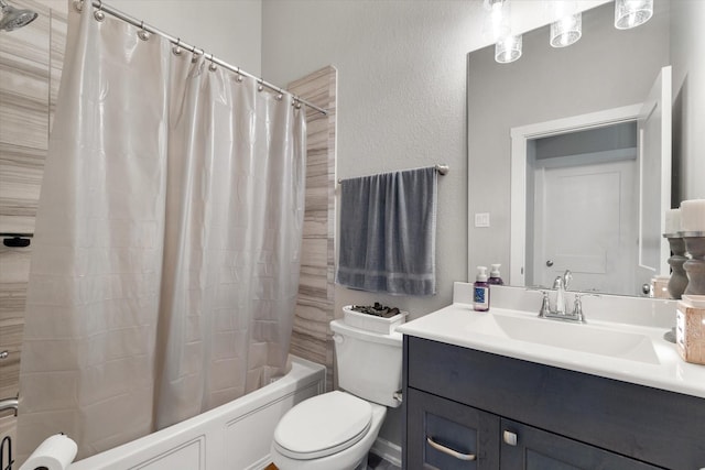 6903 Aspen Peak Dr, Baytown, TX 77521 - full bath featuring toilet, vanity, shower / bath combo, and a textured wall