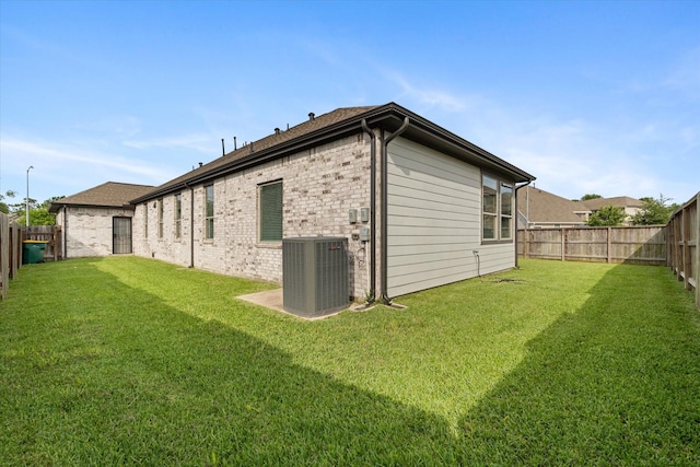 6903 Aspen Peak Dr, Baytown, TX 77521 - back of house with cooling unit and brick siding