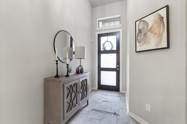 6903 Aspen Peak Dr, Baytown, TX 77521 - foyer entrance featuring light tile patterned flooring and baseboards