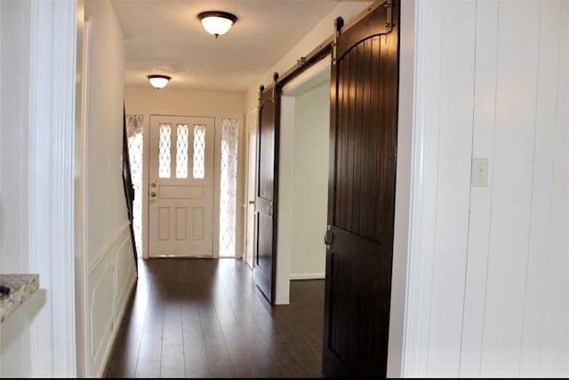 4907 Sabrina Dr, Houston, TX 77066 - entryway with a barn door and dark wood-type flooring