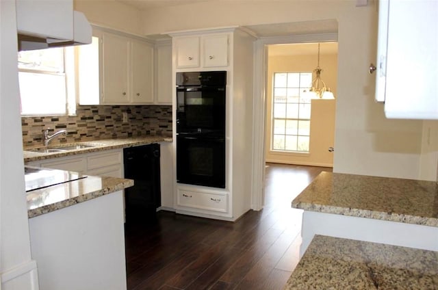 4907 Sabrina Dr, Houston, TX 77066 - kitchen with a sink, white cabinetry, dark wood finished floors, tasteful backsplash, and light stone countertops