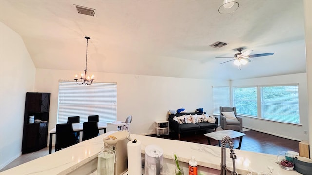 25023 Ivy Trace Ln, Katy, TX 77494 - dining area featuring lofted ceiling, a chandelier, ceiling fan, wood finished floors, and baseboards