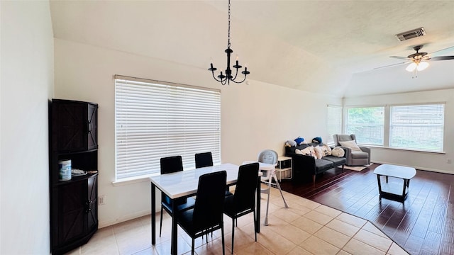 25023 Ivy Trace Ln, Katy, TX 77494 - dining room with ceiling fan, a chandelier, baseboards, lofted ceiling, and light wood-style flooring