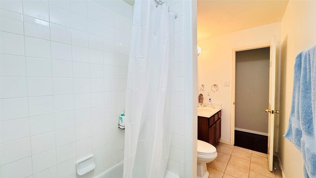 25023 Ivy Trace Ln, Katy, TX 77494 - bathroom with tile patterned floors, vanity, toilet, and shower / bath combo with shower curtain