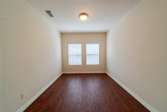 19422 Harvest Stream Way, Houston, TX 77084 - empty room featuring dark wood finished floors and baseboards