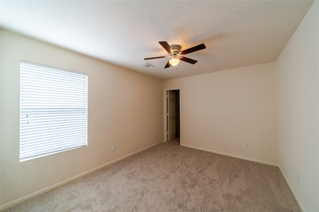 19422 Harvest Stream Way, Houston, TX 77084 - spare room with light carpet, ceiling fan, and baseboards