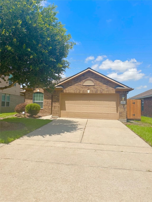 8239 Polaris Point Ln, Cypress, TX 77433 - single story home with brick siding, concrete driveway, and an attached garage