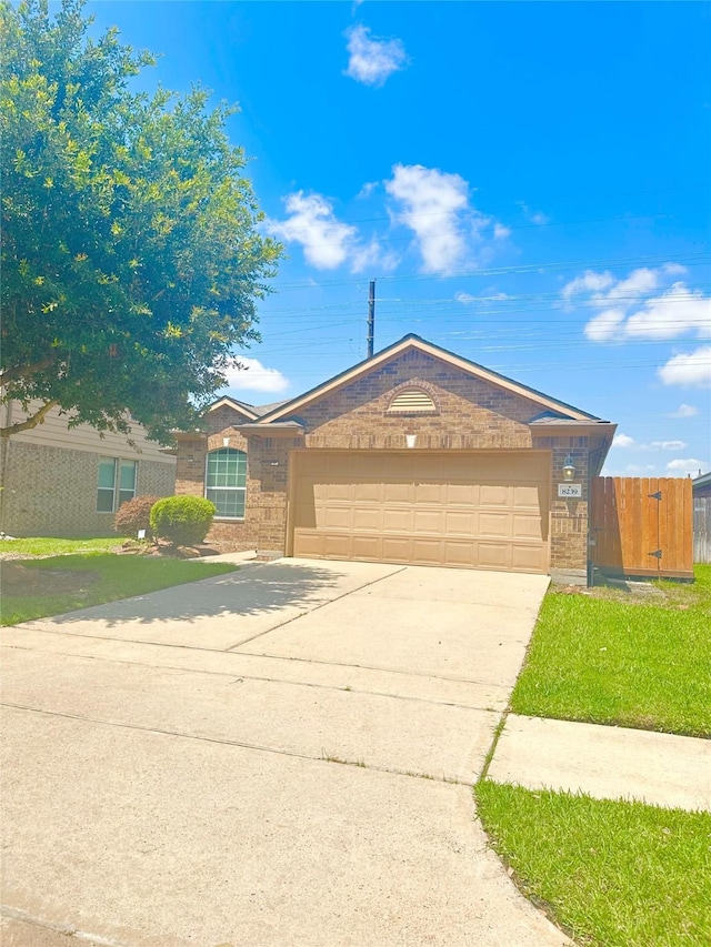 8239 Polaris Point Ln, Cypress, TX 77433 - ranch-style house featuring brick siding, an attached garage, and concrete driveway