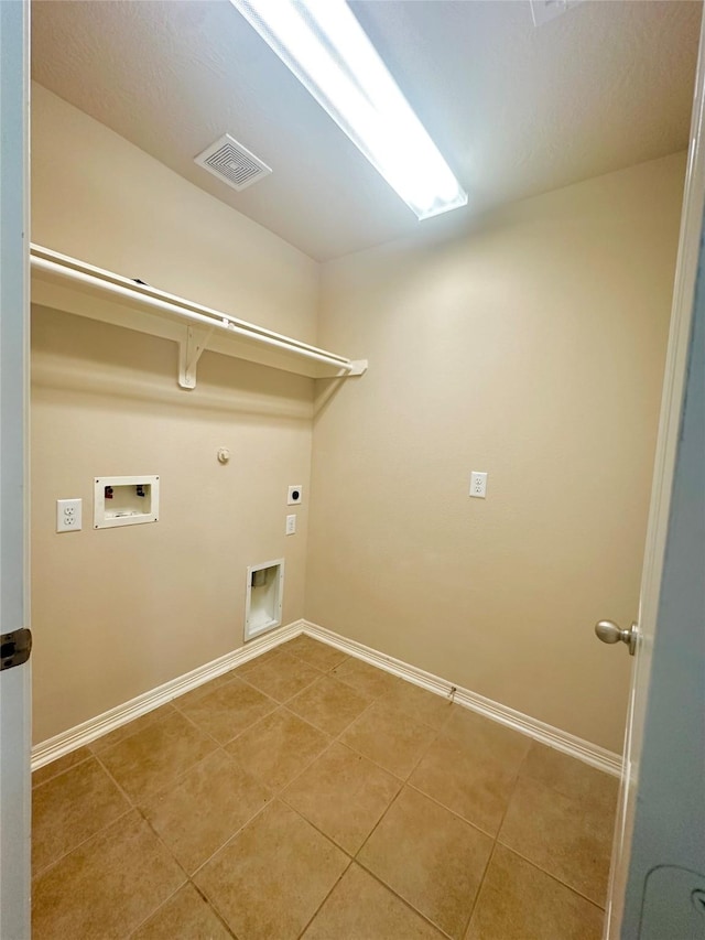 8239 Polaris Point Ln, Cypress, TX 77433 - laundry area with hookup for a gas dryer, hookup for an electric dryer, washer hookup, baseboards, and tile patterned floors