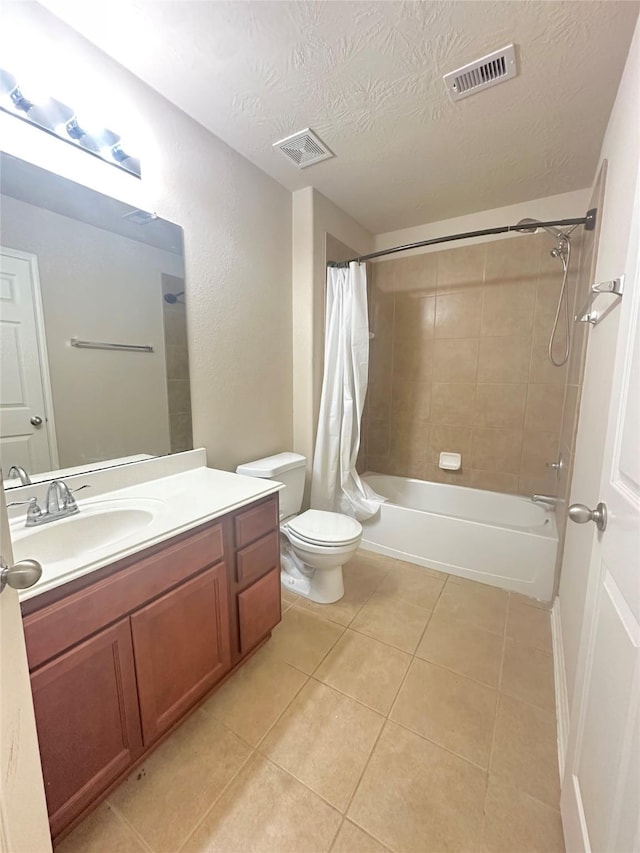 8239 Polaris Point Ln, Cypress, TX 77433 - full bathroom featuring tile patterned floors, vanity, shower / bath combination with curtain, toilet, and a textured ceiling