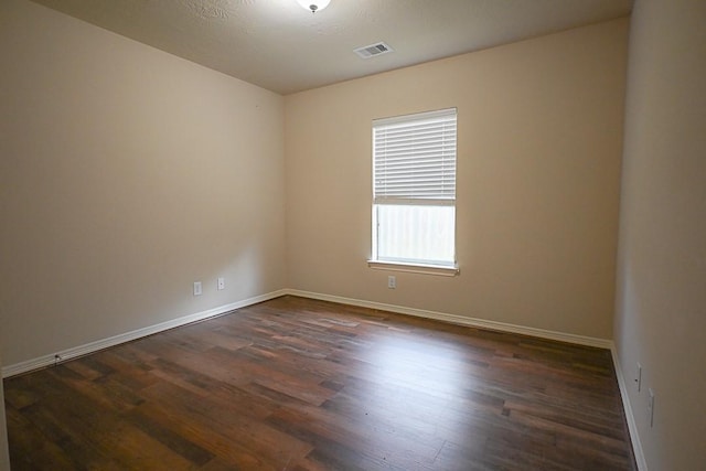 8239 Polaris Point Ln, Cypress, TX 77433 - empty room featuring dark wood finished floors and baseboards