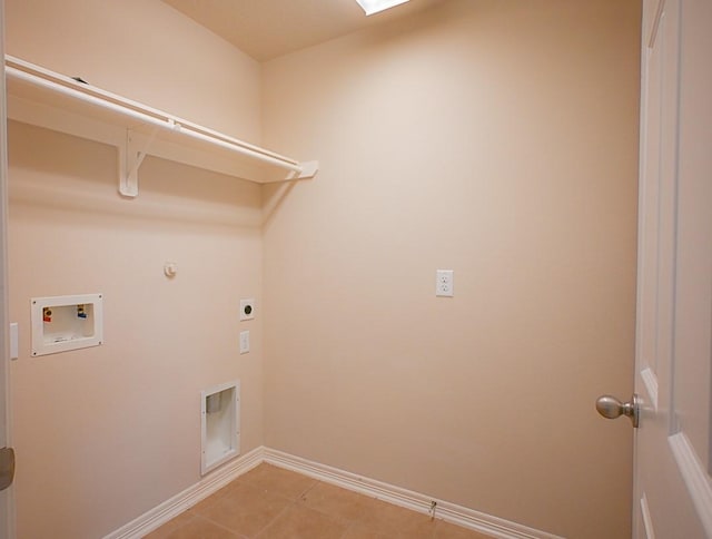 8239 Polaris Point Ln, Cypress, TX 77433 - laundry area with washer hookup, electric dryer hookup, gas dryer hookup, and light tile patterned floors
