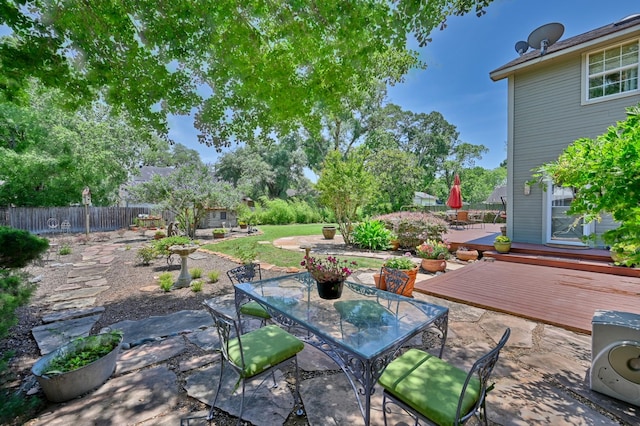 1026 Atchison St, Sealy, TX 77474 - view of patio featuring outdoor dining area and a deck
