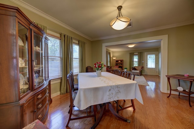 1026 Atchison St, Sealy, TX 77474 - dining area with light wood-style floors and ornamental molding