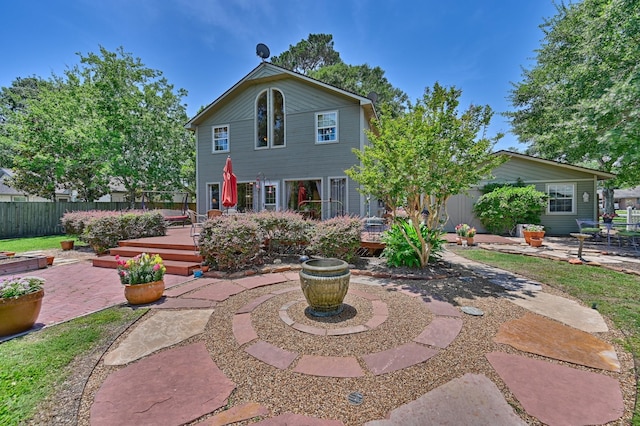 1026 Atchison St, Sealy, TX 77474 - back of house featuring a patio and a wooden deck
