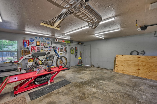 1026 Atchison St, Sealy, TX 77474 - garage with a workshop area and a garage door opener