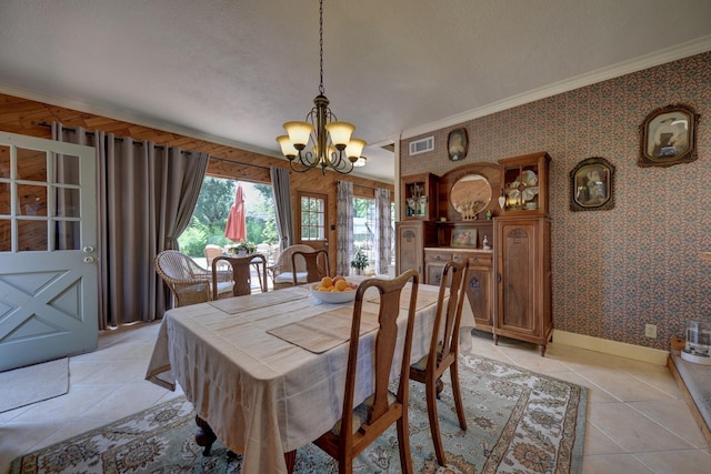 1026 Atchison St, Sealy, TX 77474 - dining space featuring a chandelier, crown molding, light tile patterned flooring, and wallpapered walls