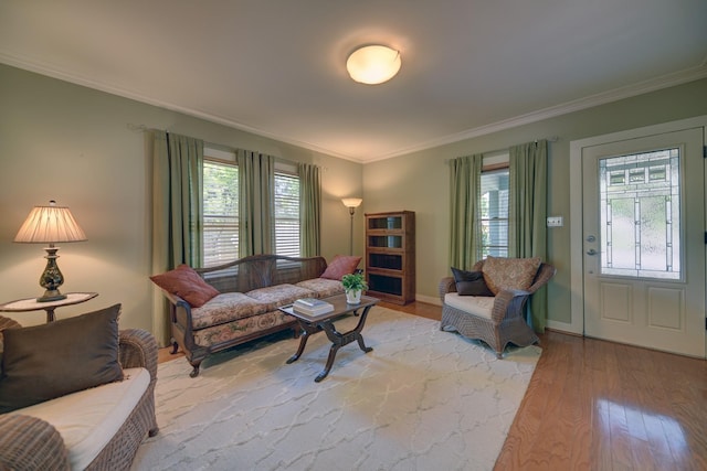 1026 Atchison St, Sealy, TX 77474 - living room with crown molding, light wood-style floors, and healthy amount of natural light