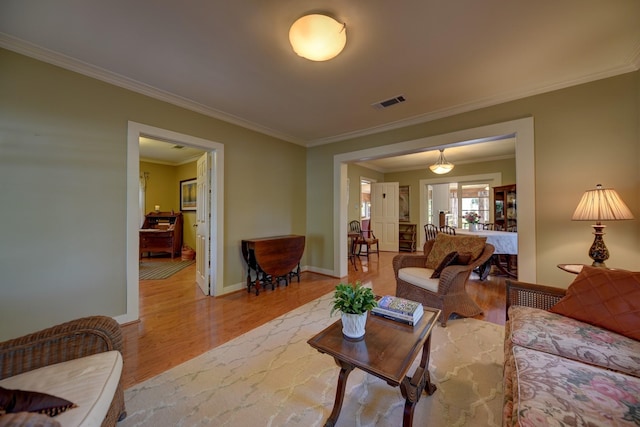 1026 Atchison St, Sealy, TX 77474 - living room with wood finished floors and ornamental molding