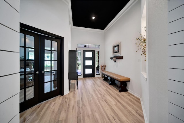 11698 Creek View Ln, Conroe, TX 77385 - foyer with french doors, ornamental molding, wood finished floors, and baseboards