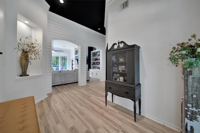 11698 Creek View Ln, Conroe, TX 77385 - corridor with light wood finished floors and arched walkways
