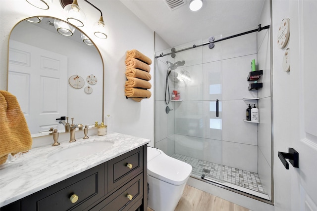 11698 Creek View Ln, Conroe, TX 77385 - bathroom with vanity, a shower stall, toilet, and wood finished floors