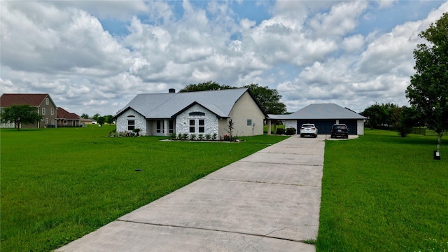 9035 N Point Dr, Beach City, TX 77523 - view of front of house featuring a front yard, driveway, stone siding, and an outdoor structure