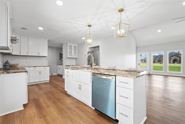 9035 N Point Dr, Beach City, TX 77523 - kitchen with dishwasher, backsplash, light wood-style floors, recessed lighting, and white cabinetry