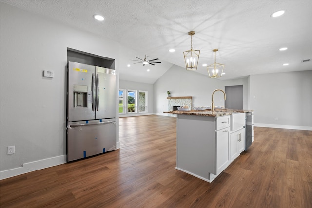 9035 N Point Dr, Beach City, TX 77523 - kitchen with appliances with stainless steel finishes, vaulted ceiling, baseboards, a ceiling fan, and recessed lighting