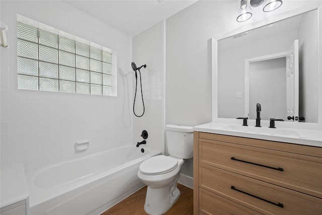 9035 N Point Dr, Beach City, TX 77523 - bathroom with toilet, vanity, bathing tub / shower combination, and wood finished floors