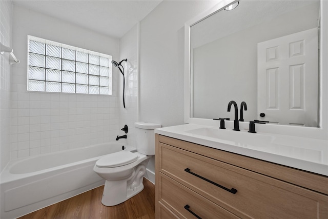 9035 N Point Dr, Beach City, TX 77523 - bathroom featuring vanity, wood finished floors, toilet, and  shower combination