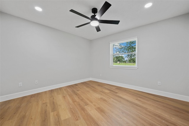 9035 N Point Dr, Beach City, TX 77523 - empty room featuring baseboards, light wood-style floors, a ceiling fan, and recessed lighting