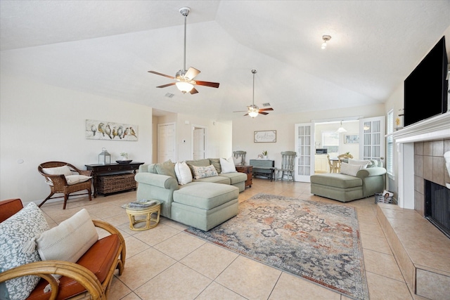 115 N River Place Rd, Rio Frio, TX 78879 - living room featuring light tile patterned floors, a ceiling fan, a tile fireplace, and high vaulted ceiling