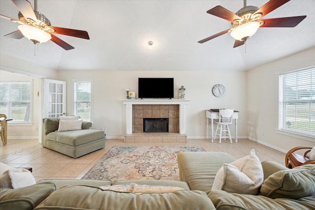 115 N River Place Rd, Rio Frio, TX 78879 - living room featuring ceiling fan, light tile patterned flooring, lofted ceiling, a fireplace, and baseboards