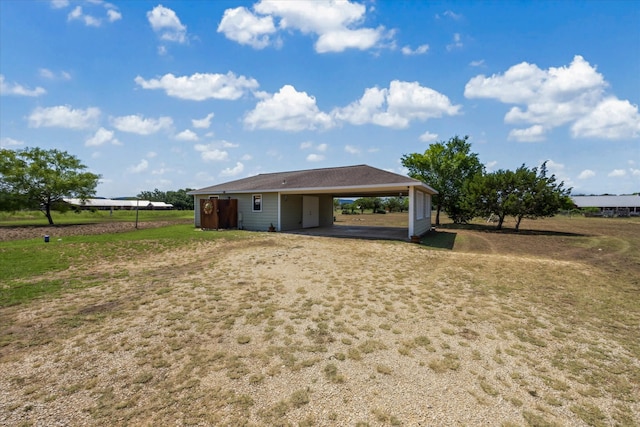115 N River Place Rd, Rio Frio, TX 78879 - back of house with a carport and a lawn