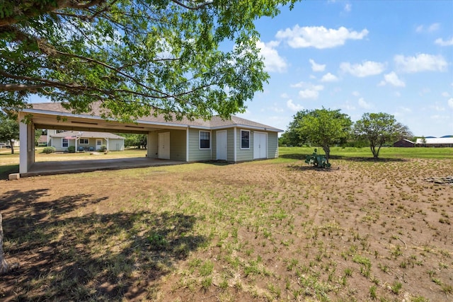 115 N River Place Rd, Rio Frio, TX 78879 - view of grassy yard with an attached carport