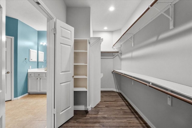 16610 Avenfield Rd, Tomball, TX 77377 - walk in closet featuring a sink and wood finished floors