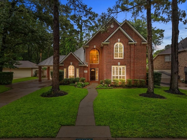 16610 Avenfield Rd, Tomball, TX 77377 - view of front facade featuring brick siding and a front lawn