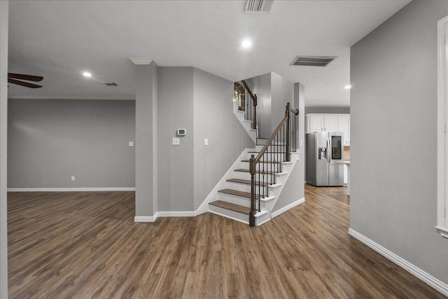 16610 Avenfield Rd, Tomball, TX 77377 - staircase with wood finished floors, ceiling fan, recessed lighting, and ornamental molding